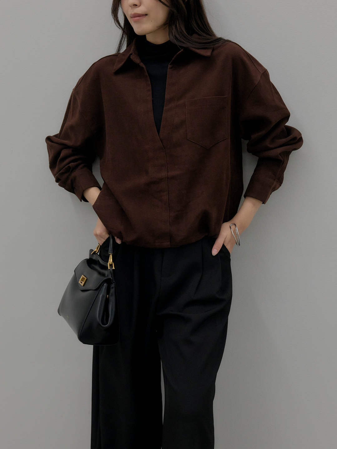 ドッキングデザイン裾ドロストスエードシャツ