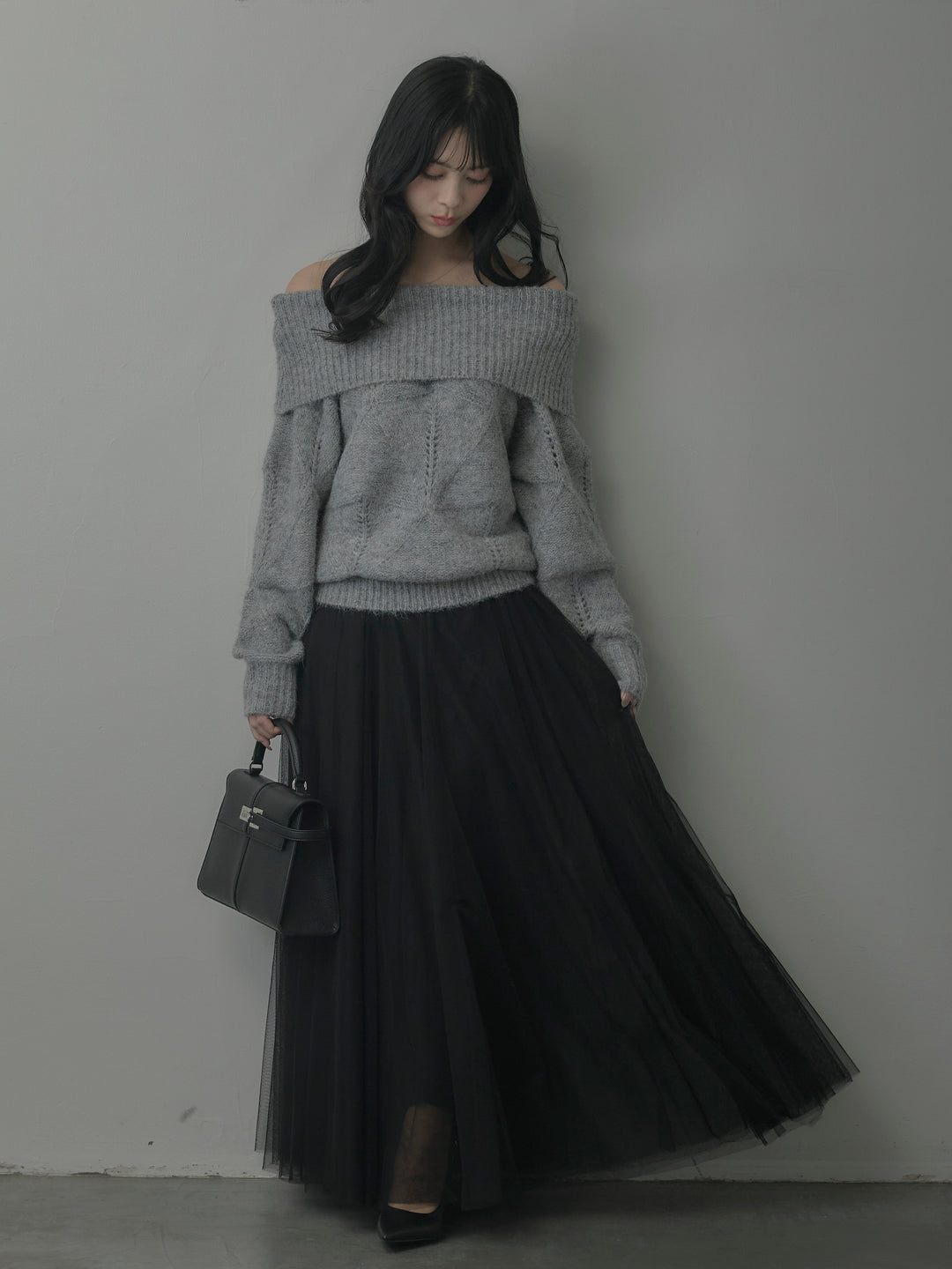 メランジニットオフショルトップス