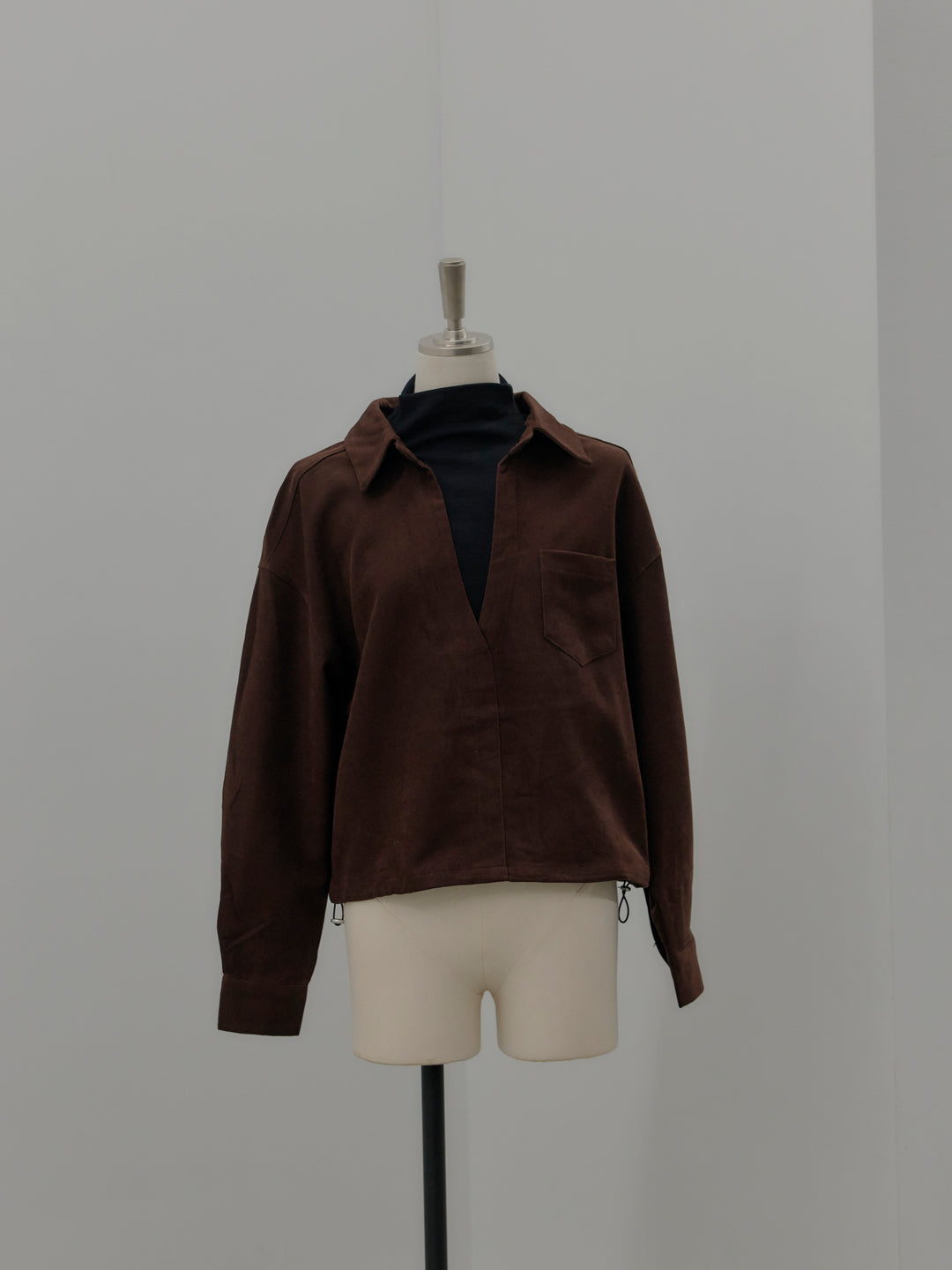 ドッキングデザイン裾ドロストスエードシャツ