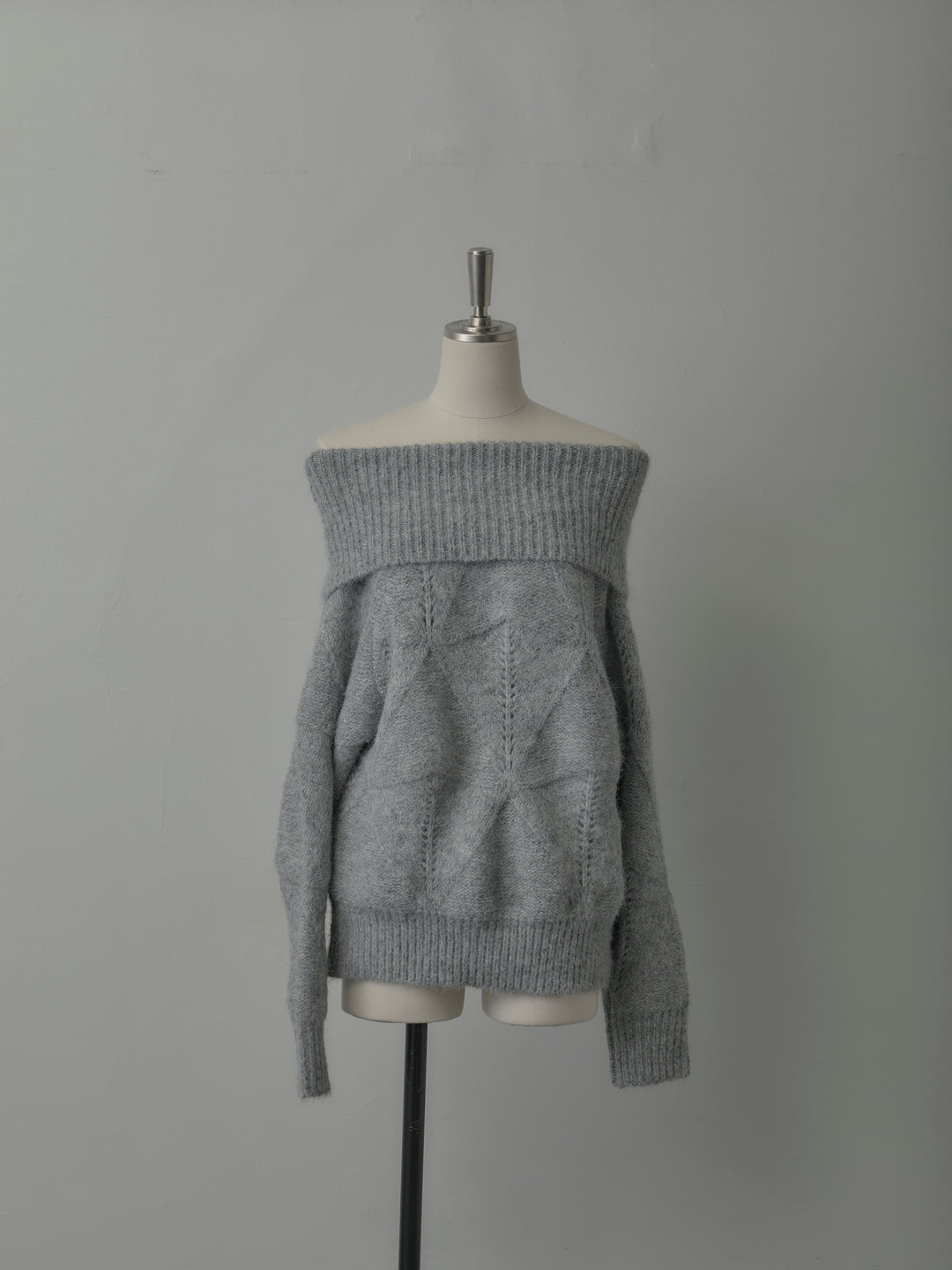 メランジニットオフショルトップス