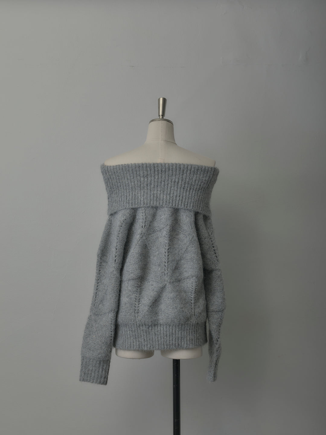 メランジニットオフショルトップス